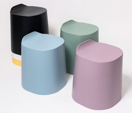 An assortment of Peekaboo stools, three sitting next to each other and three stacked on top of each other